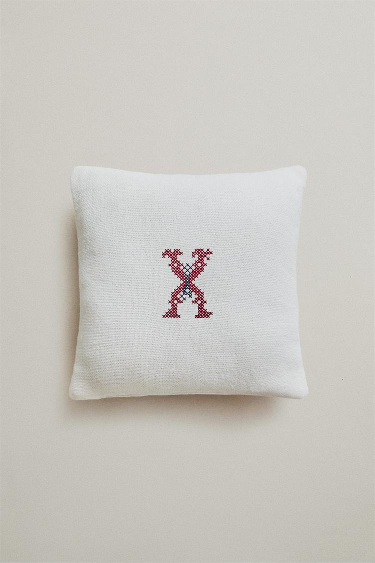 EMBROIDERED LETTER X LINEN CUSHION — Ecru