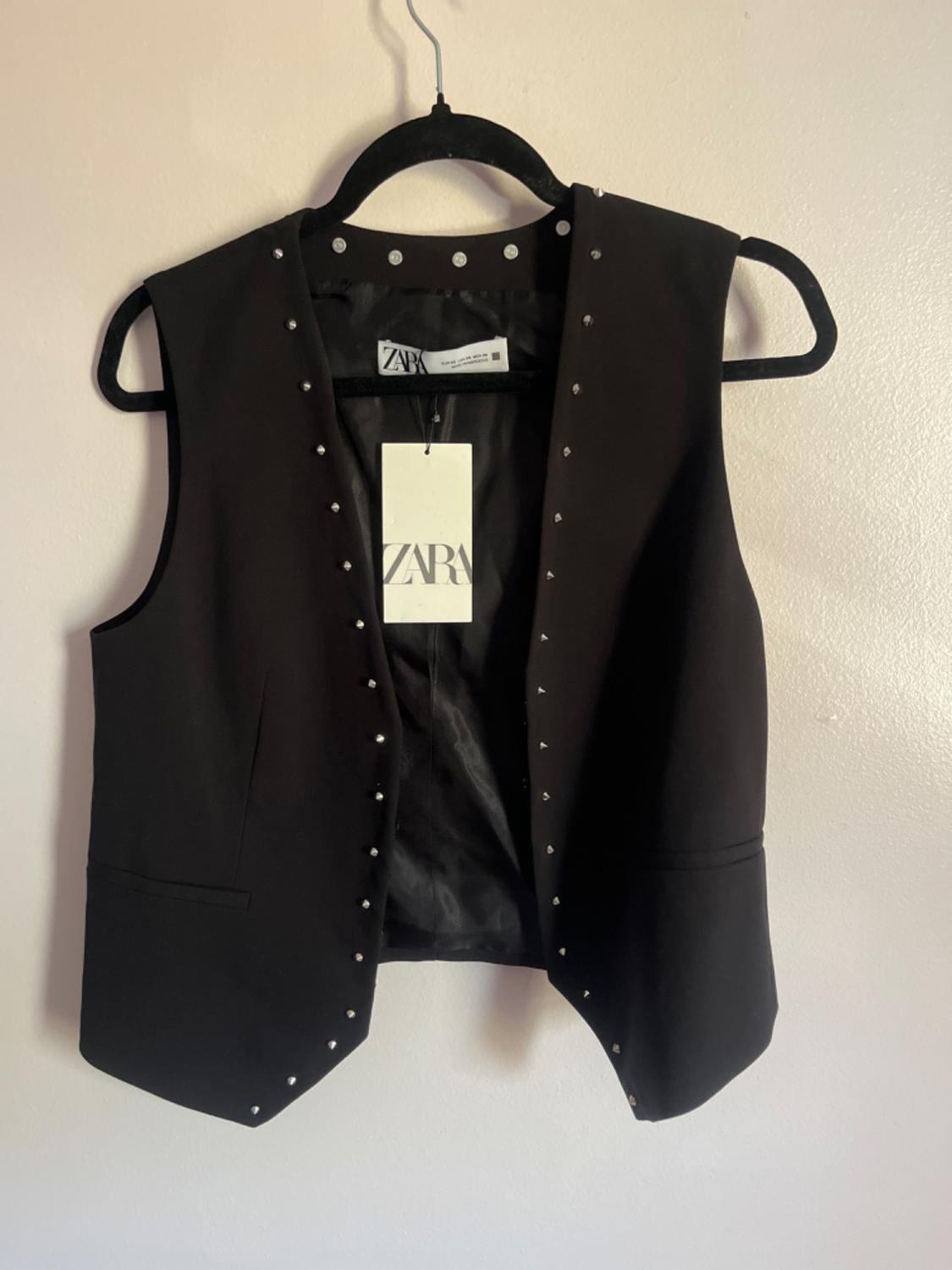 STUDDED VEST