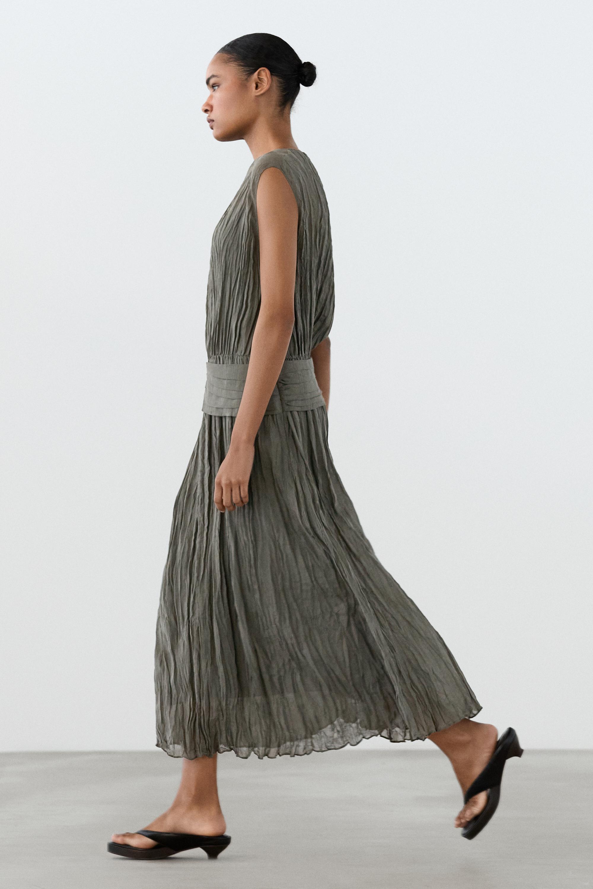 Textured flowing fabric dress with sash belt