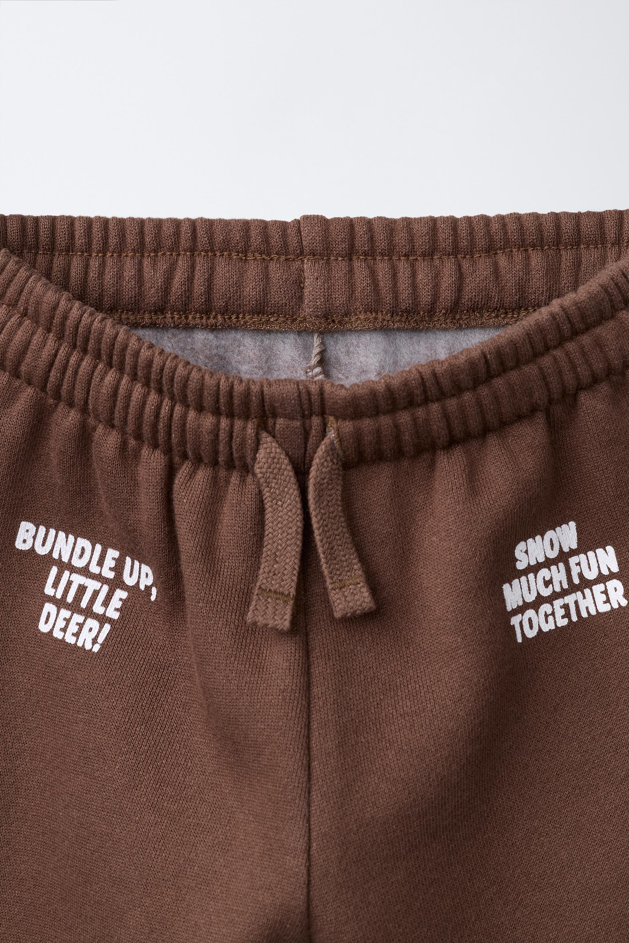 FLOCKED TEXT JOGGER PANTS