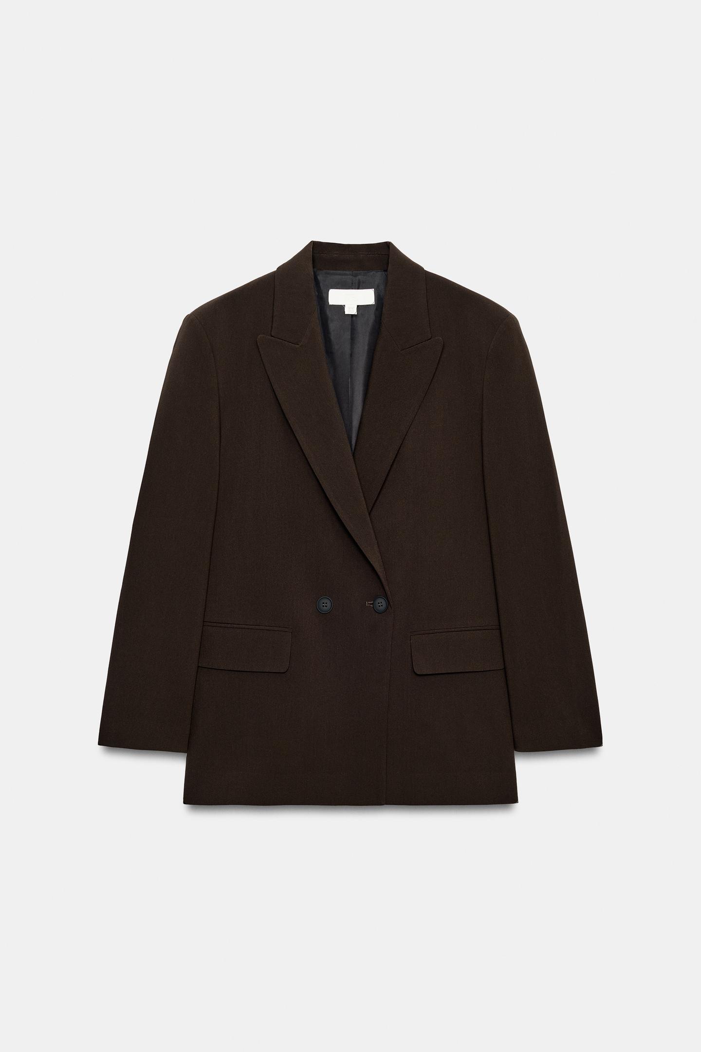 Front view of a dark brown blazer with a lapel collar, double-breasted button fastening and two front flap pockets.