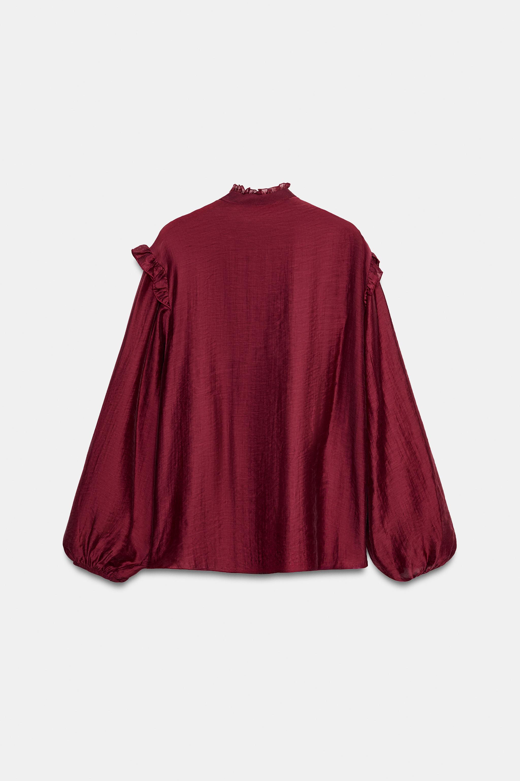 BLOUSE SEMI-TRANSPARENTE À VOLANTS