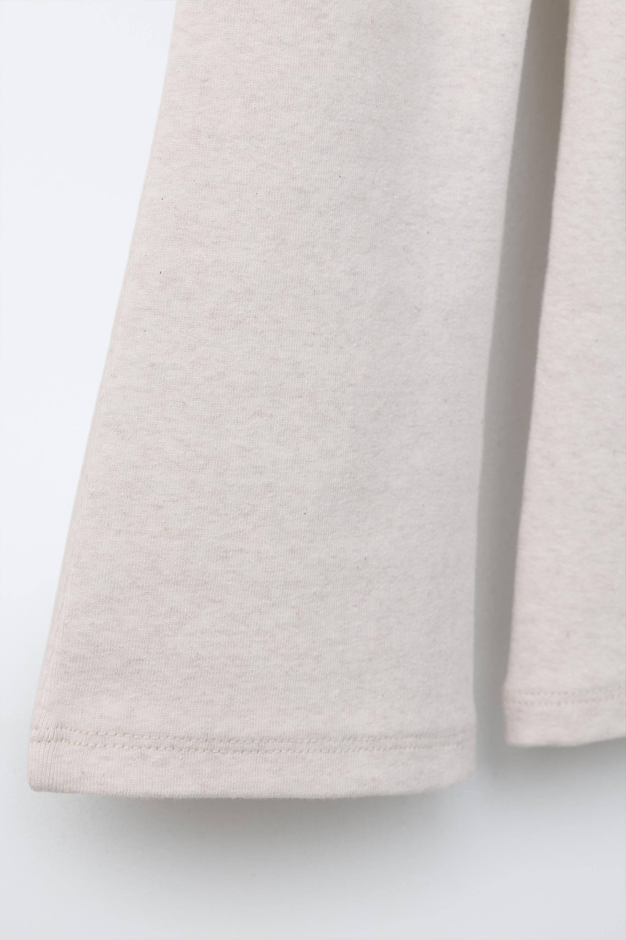 LABEL DETAIL INTERLOCK FLARE LEGGINGS
