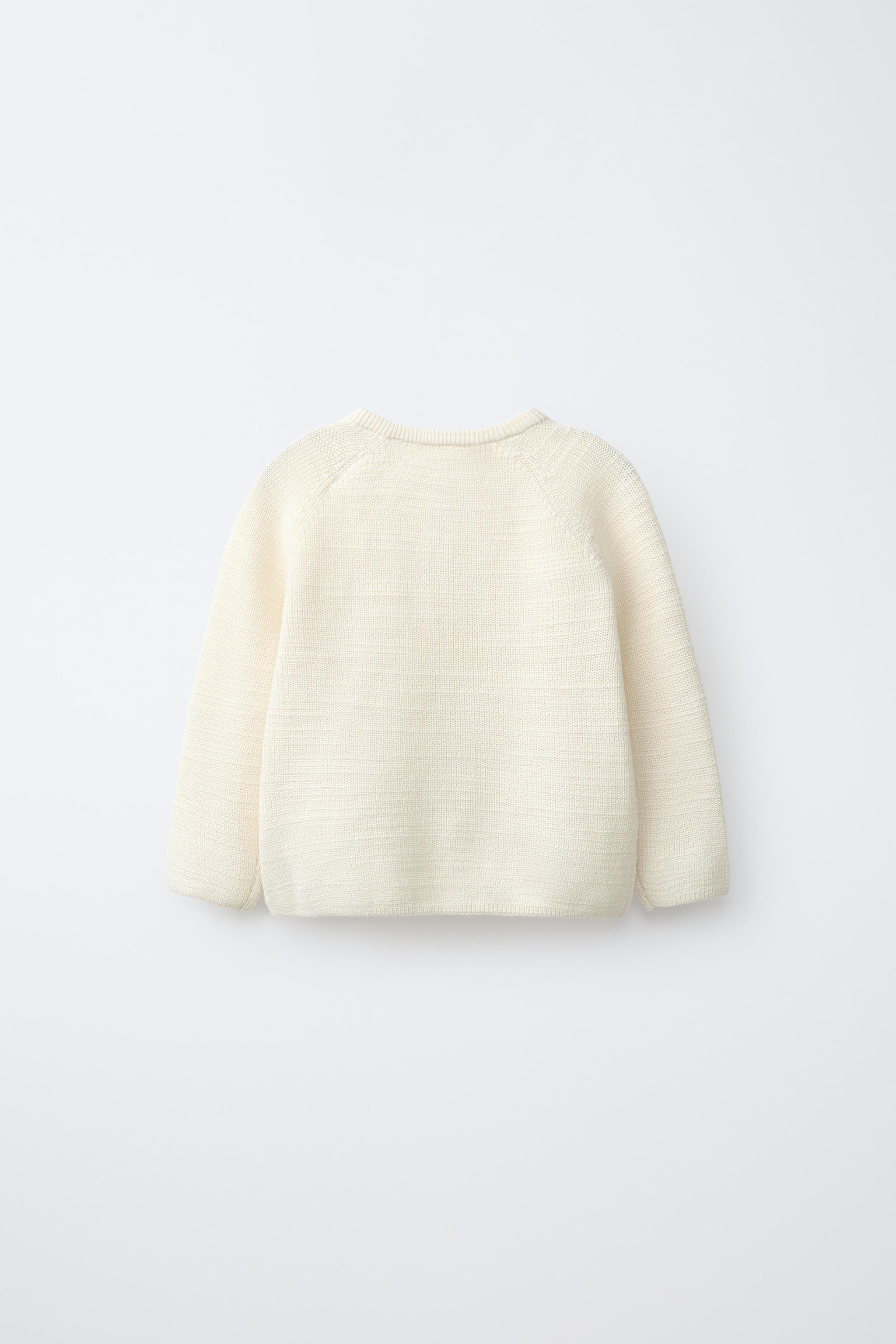 PULL EN MAILLE PERLÉE AVEC ÉTIQUETTE