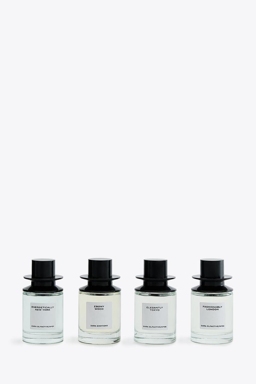 Four perfume bottles with labels: "Energetically New York", "Ebony Wood", "Elegantly Tokyo", "Fashionably London".