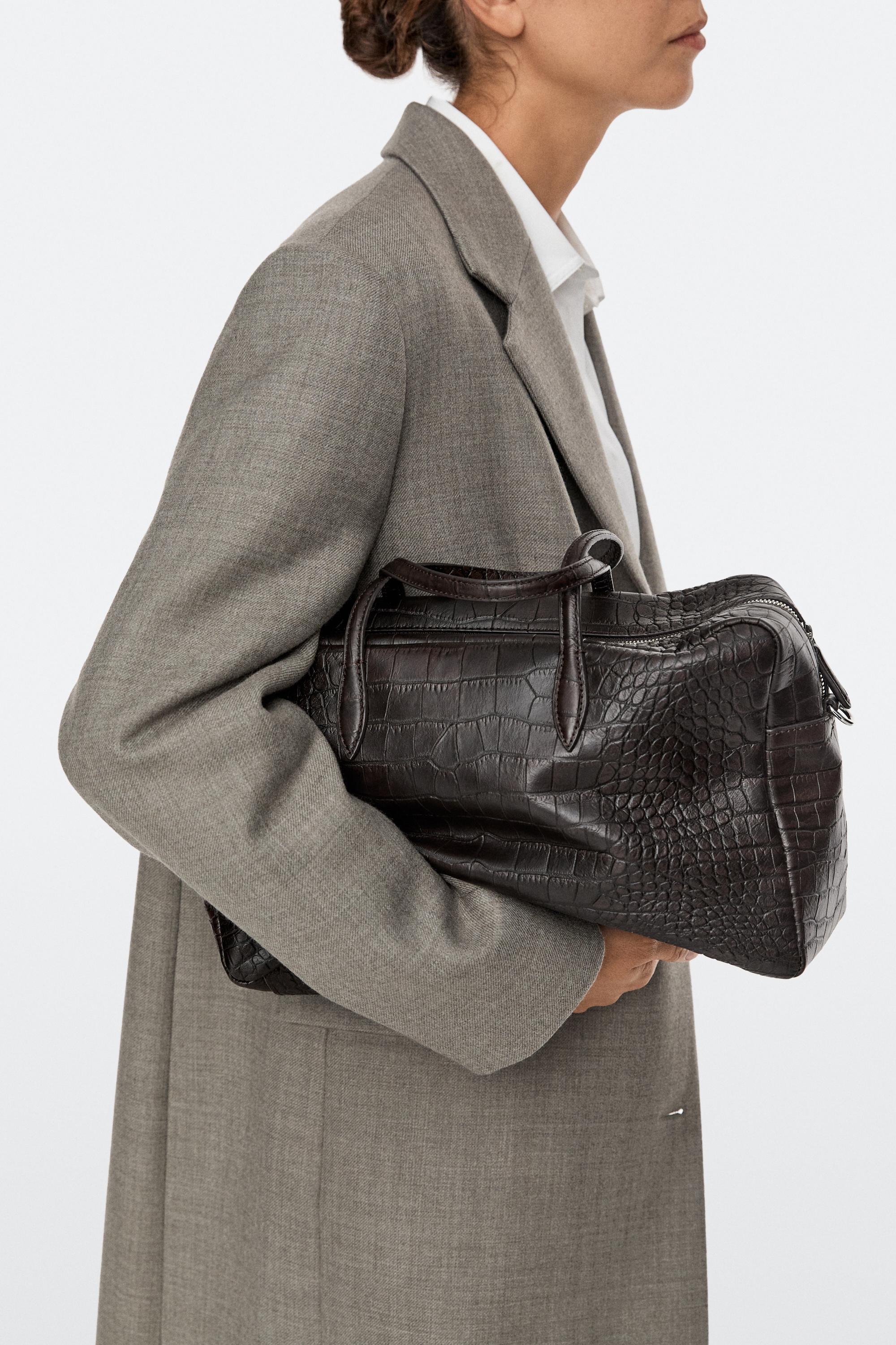 Medium leather textured duffle bag