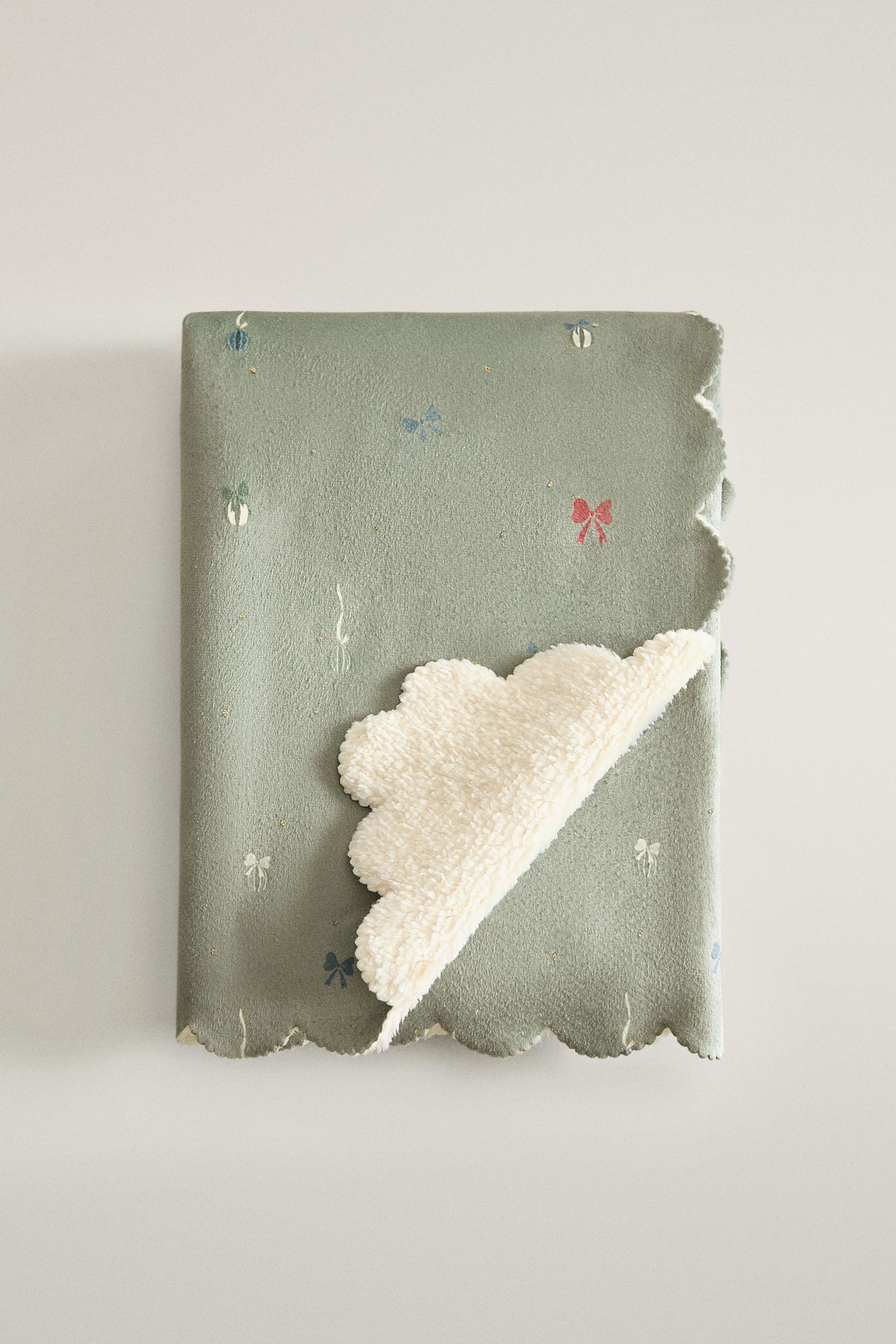 COUVERTURE ENFANT IMITATION MOUTON NOEUDS NOËL