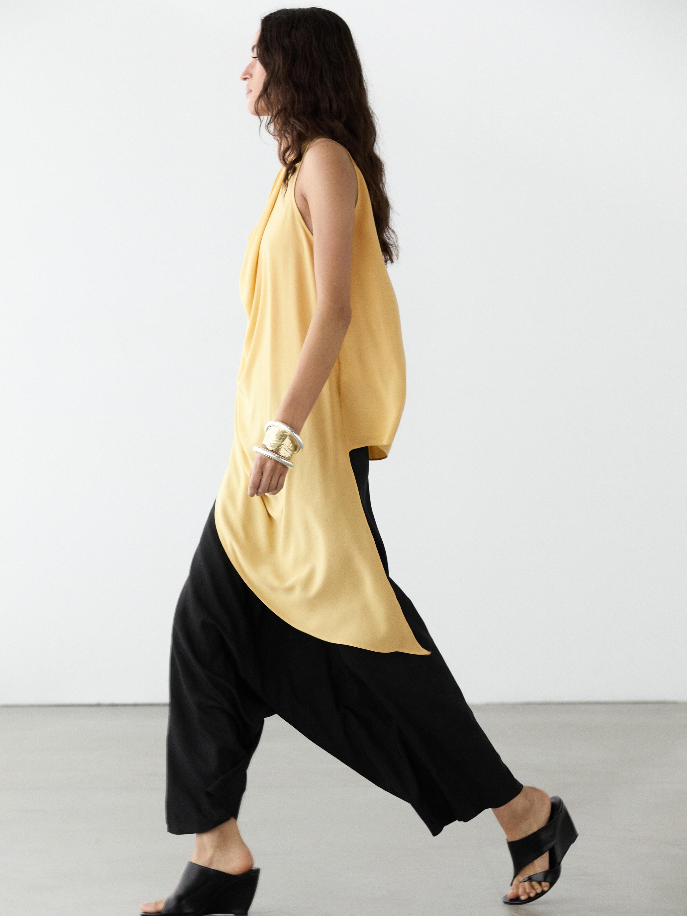 Top long fluide asymétrique