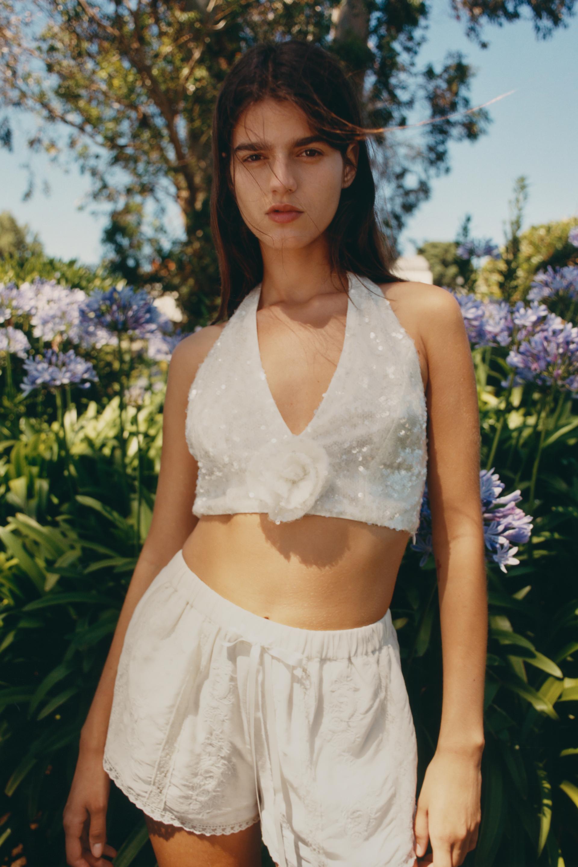 HALTER NECK TOP WITH SEQUINNED FLOWER