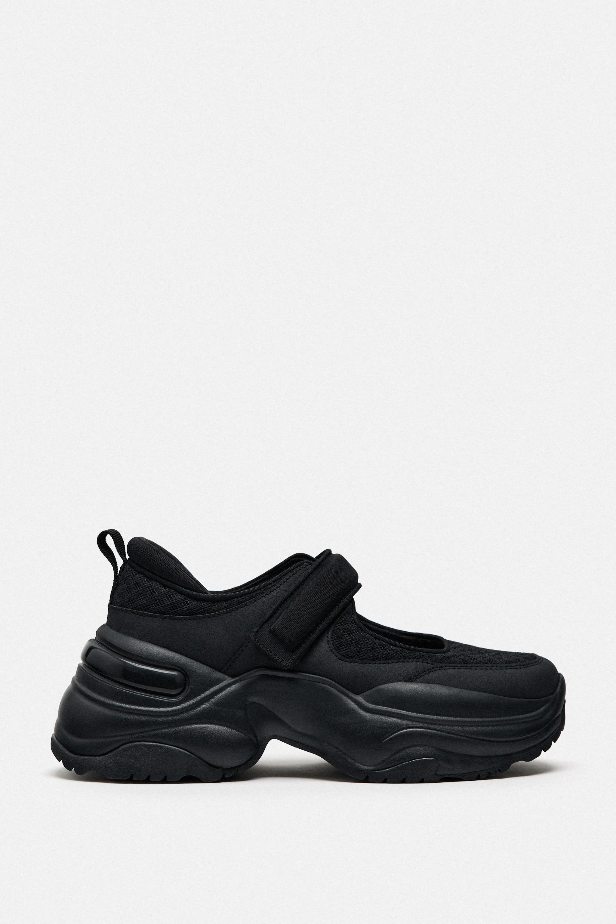 Black flat hot sale trainers