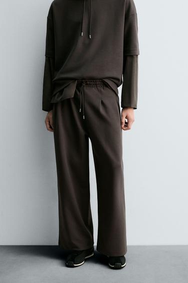 NEOPRENE-EFFECT PLEATED TROUSERS WITH LABEL - Dark brown by Zara