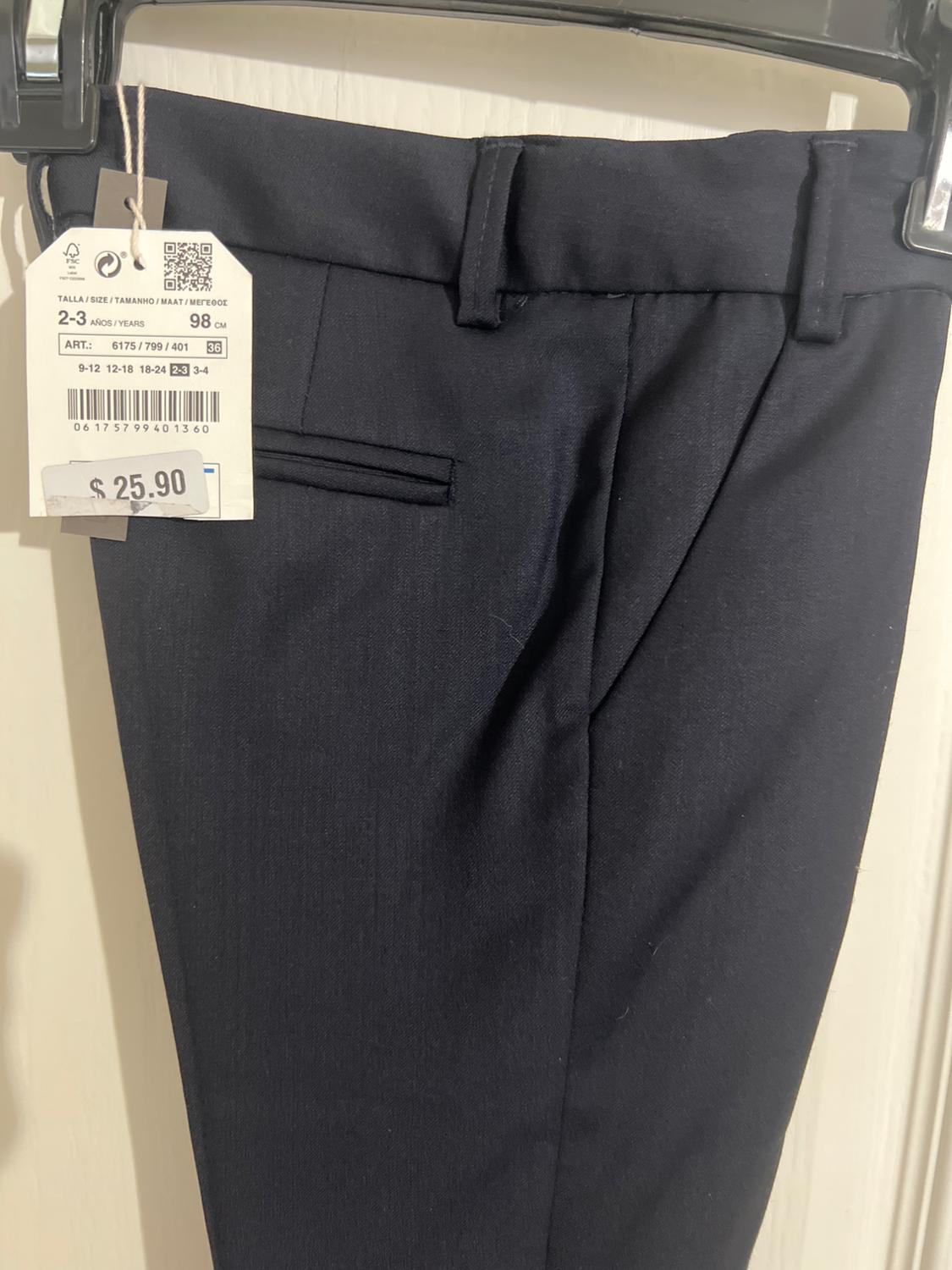 Dark pants on a black hanger. Label with text: SIZE 2-3 YEARS / 98 CM ART.: 6175 / 799 / 401 $ 25.90.