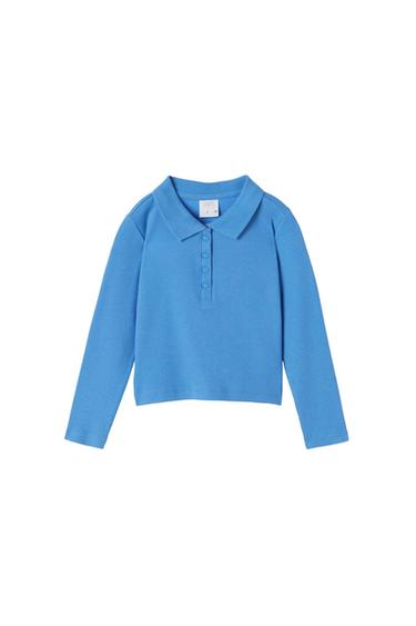 Long-sleeved blue polo shirt with a ribbed texture, classic collar and four front buttons against a white background. Inner ZARA label.