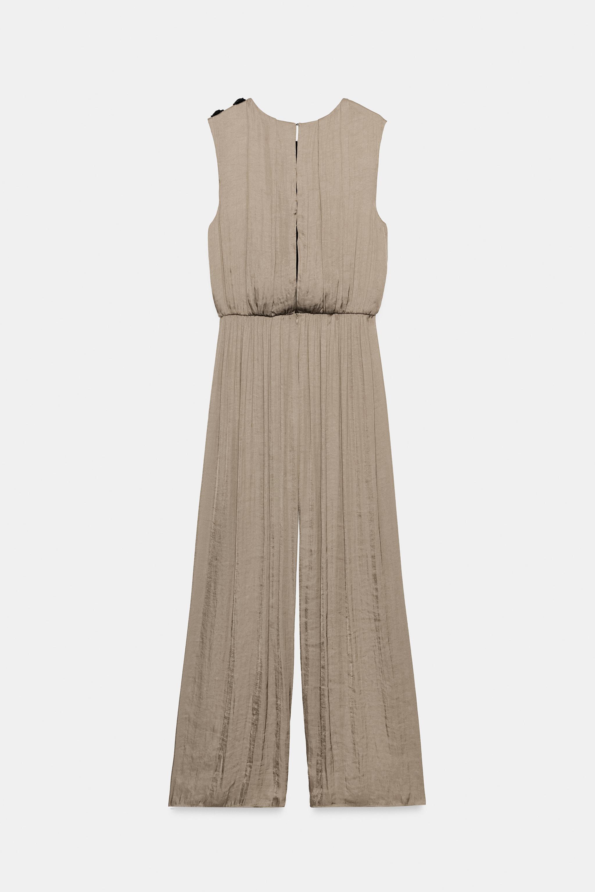 SATIN JUMPSUIT WITH SHOULDER FROG FASTENING