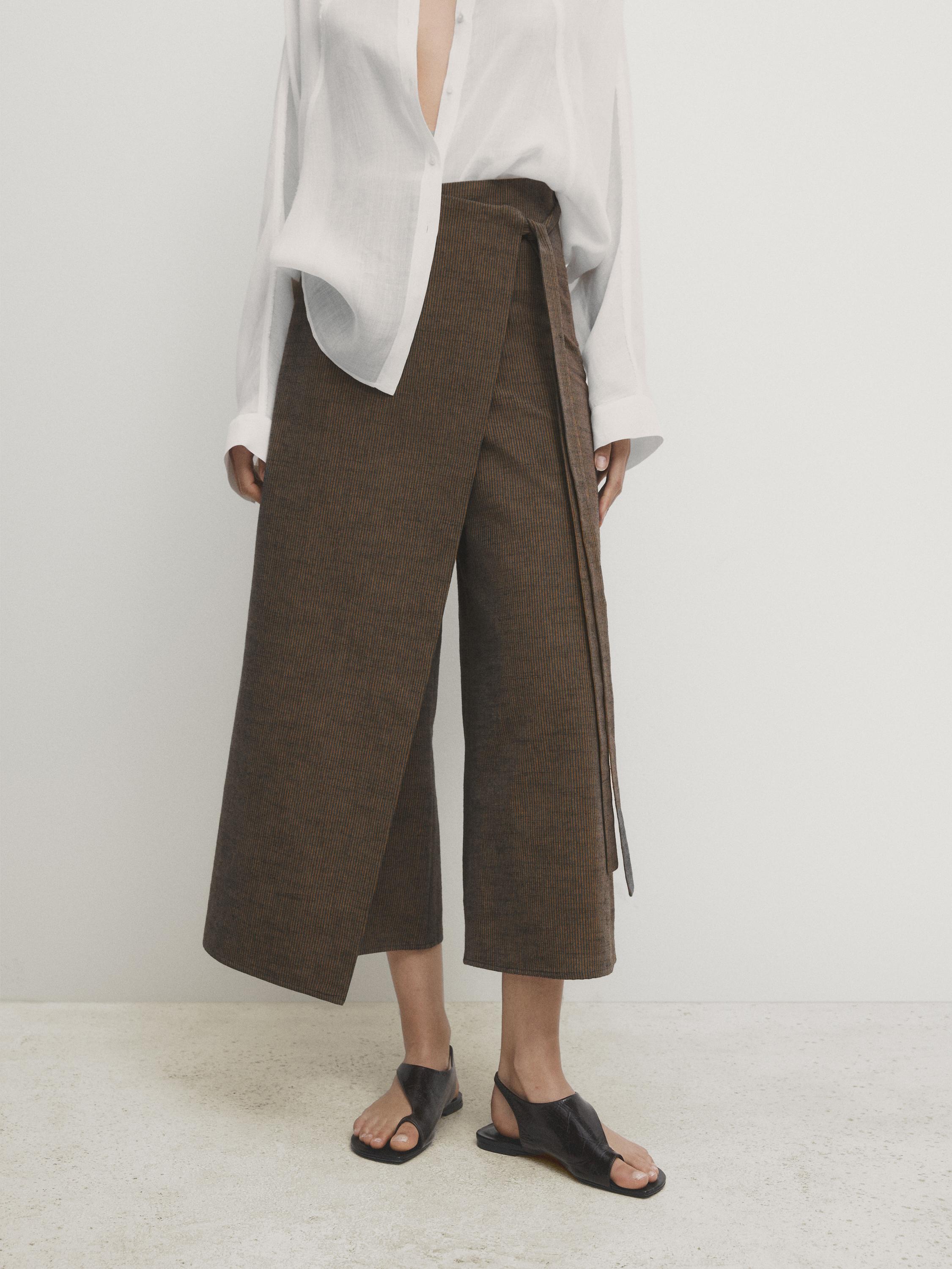 Two-tone striped skirt over trousers