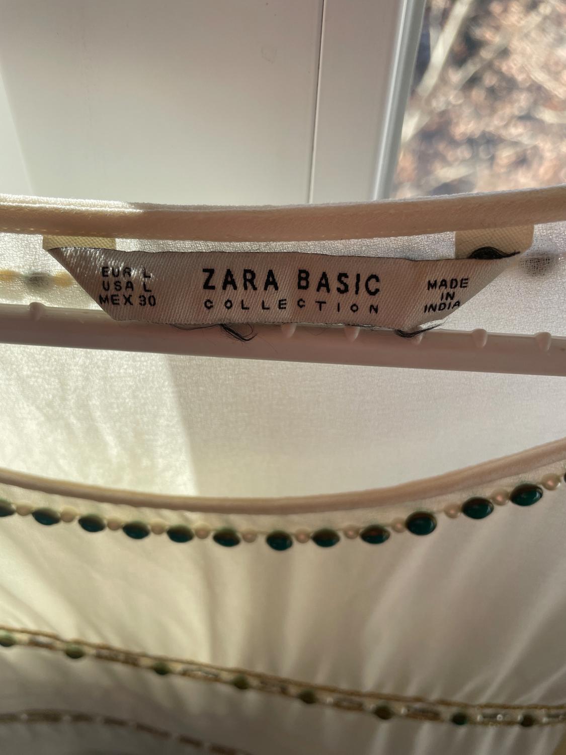 BLUSA BLANCA CON TRAZOS DORADOS - Image 3