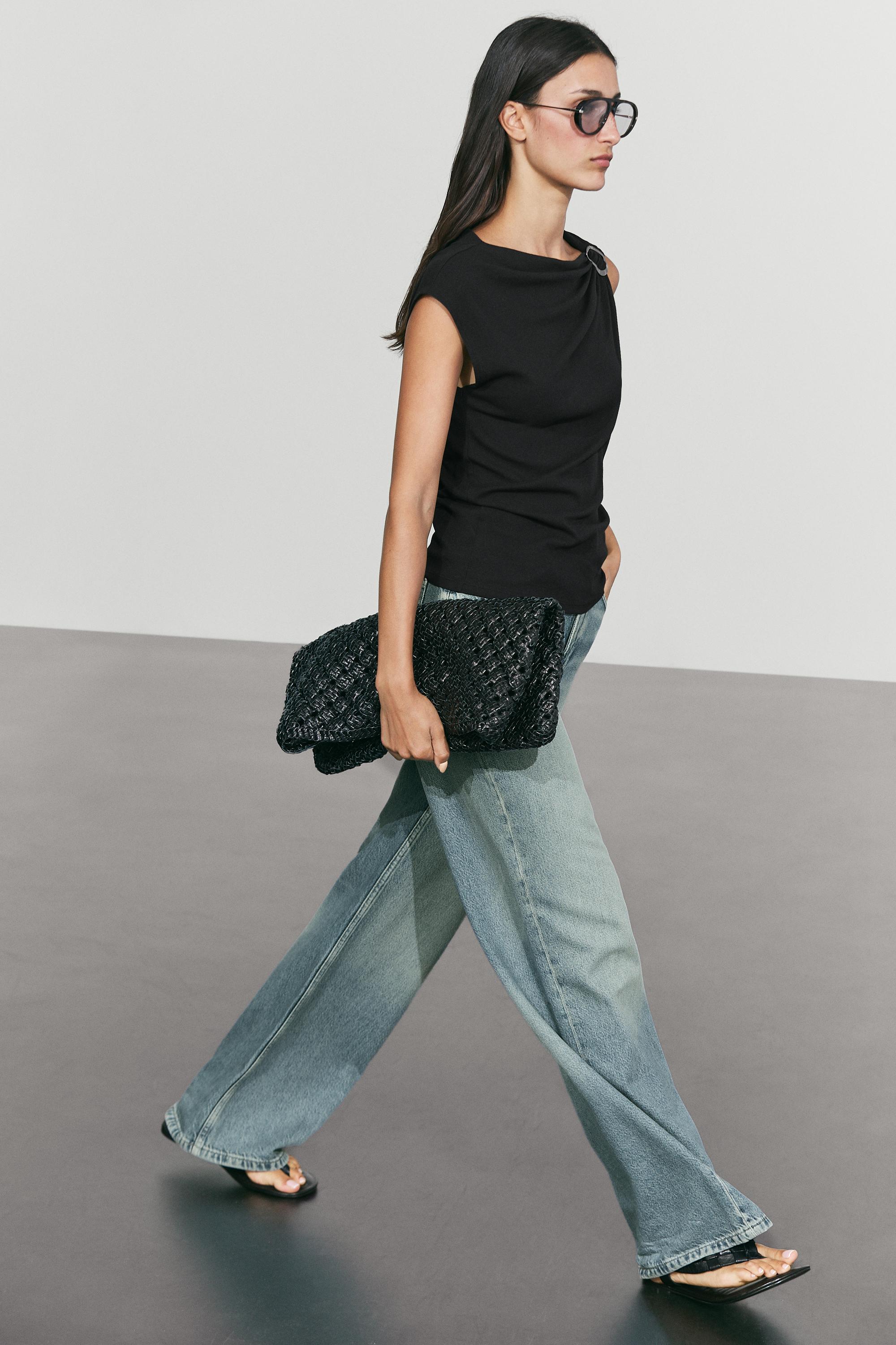 Asymmetric metal detail top
