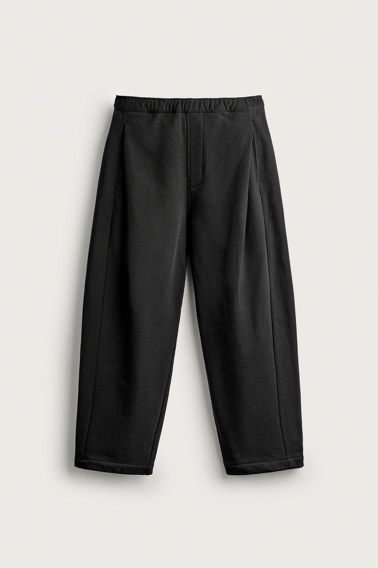 Pantalon jogger pliegues laterales