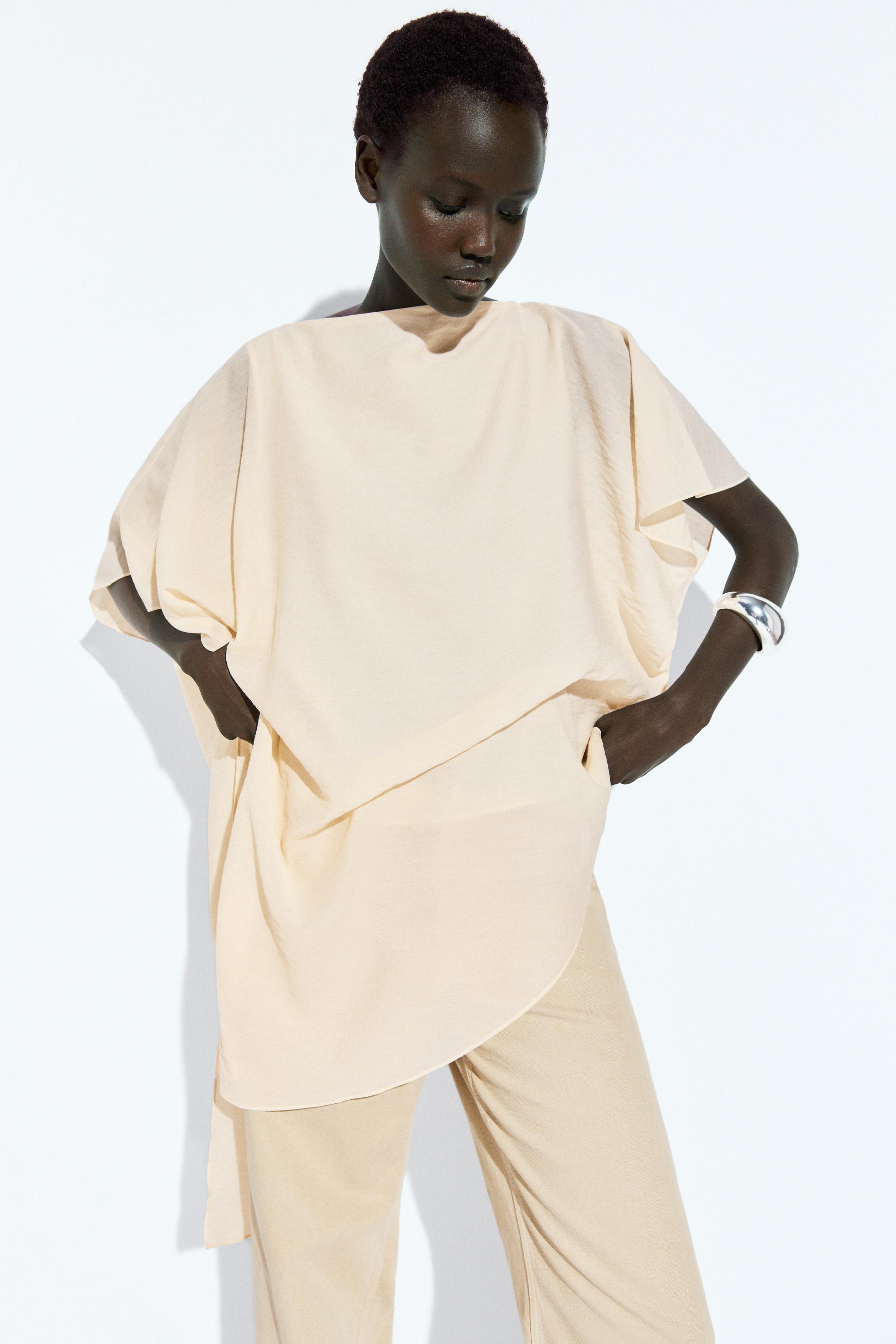 Blouse fluide asymétrique style cape