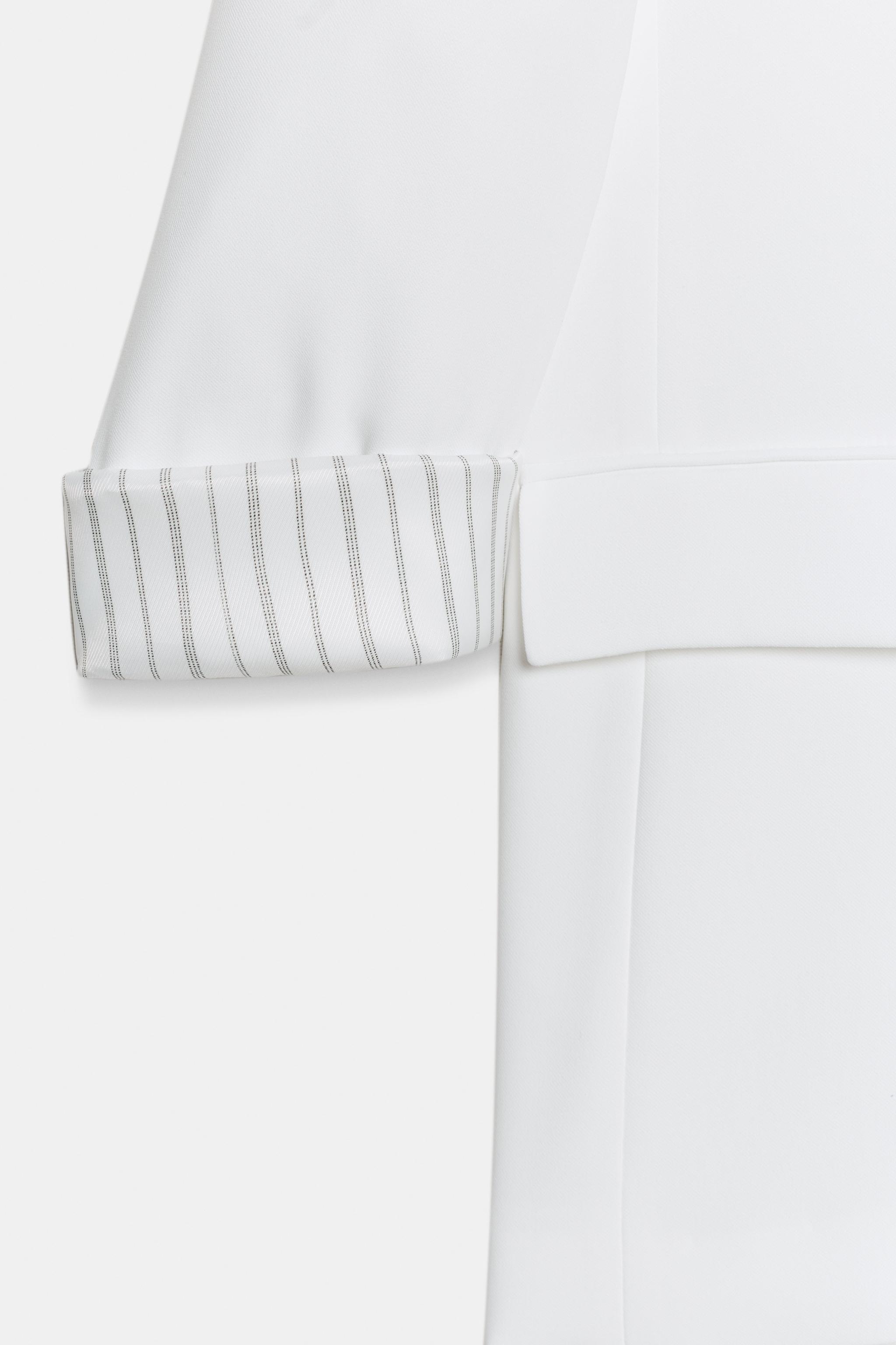 VESTE À MANCHES RETROUSSÉES ET POIGNETS IMPRIMÉS