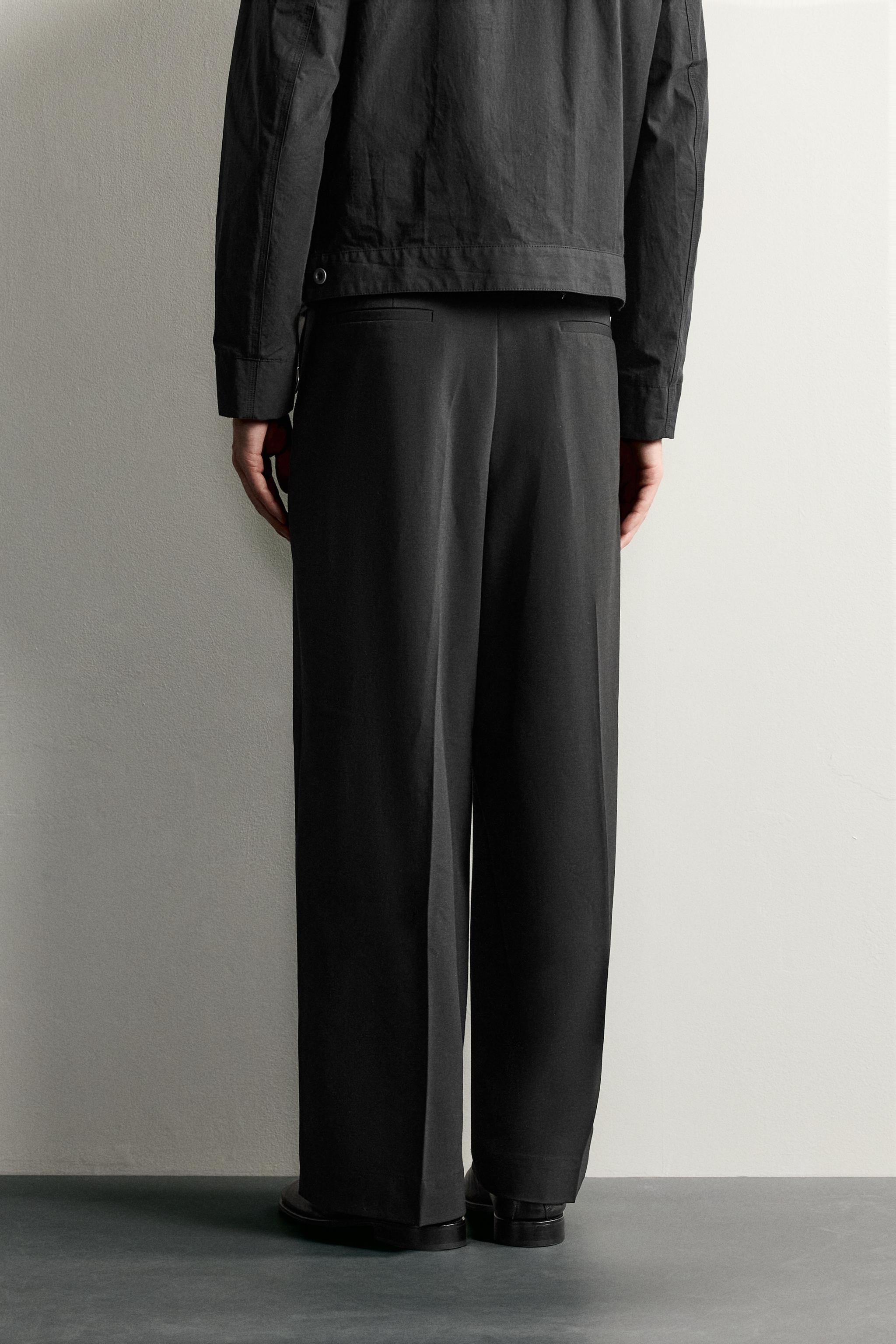 RELAXED-FIT PLEATED PANTS