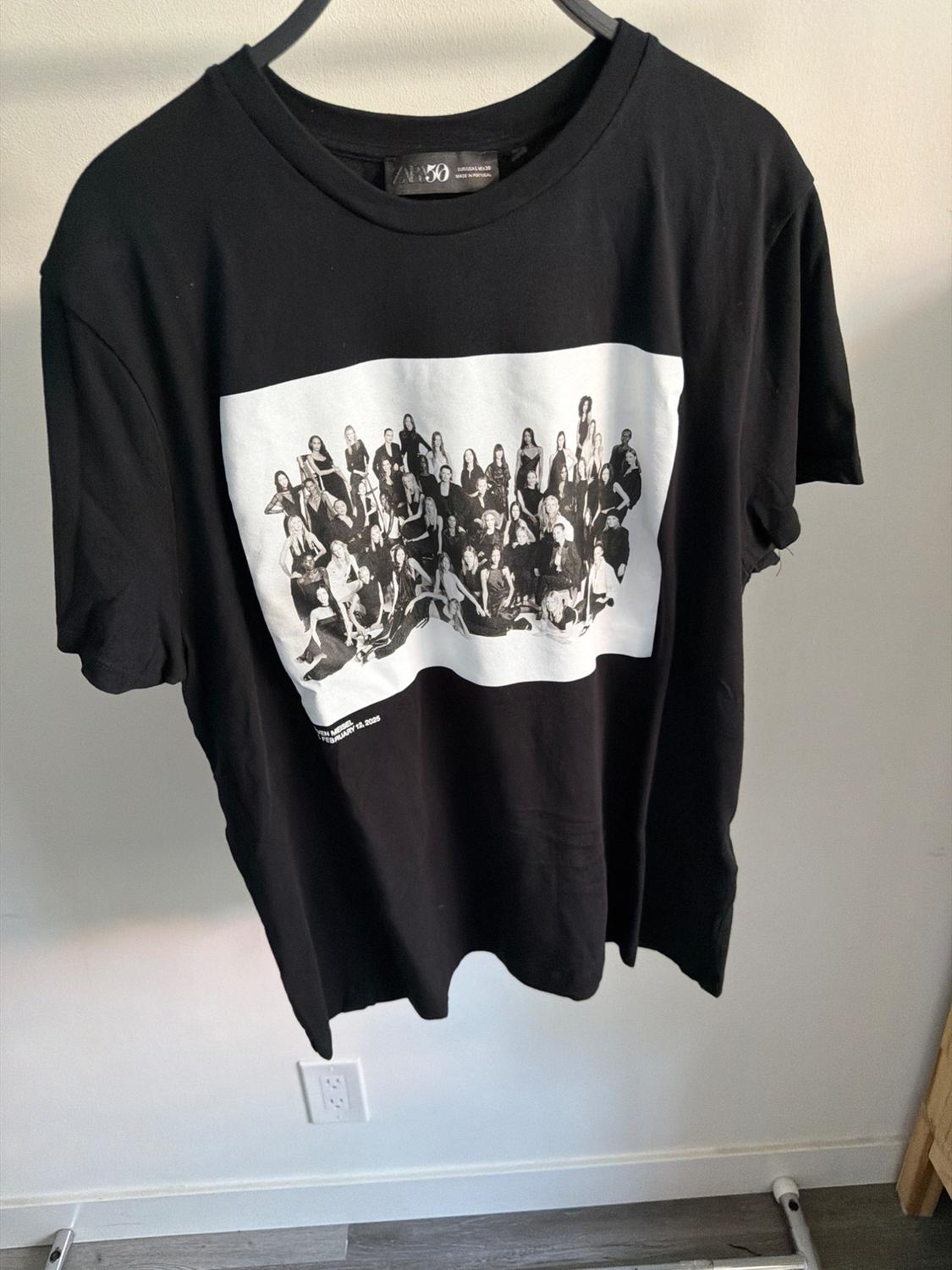 Black T-shirt with a black and white image of a group of people. Visible text: "The White Show, 50th Anniversary, 2020".
