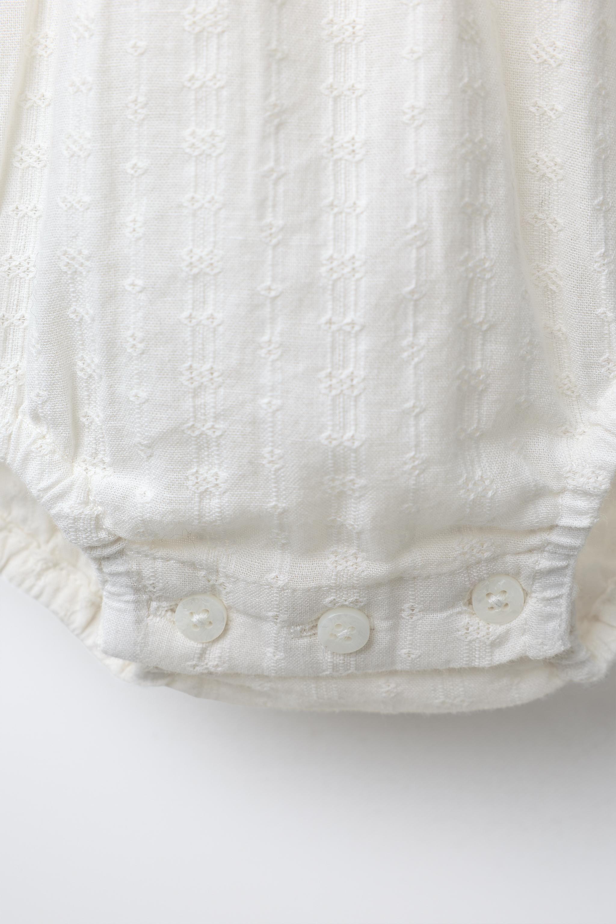 EMBROIDERED FAGOTING BODYSUIT