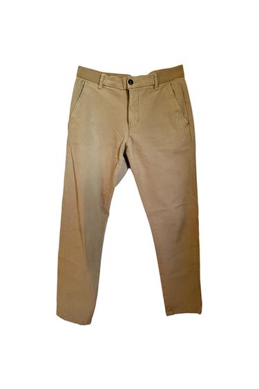 Beige chino-style pants with a button and zipper closure, presented on a plain white background.