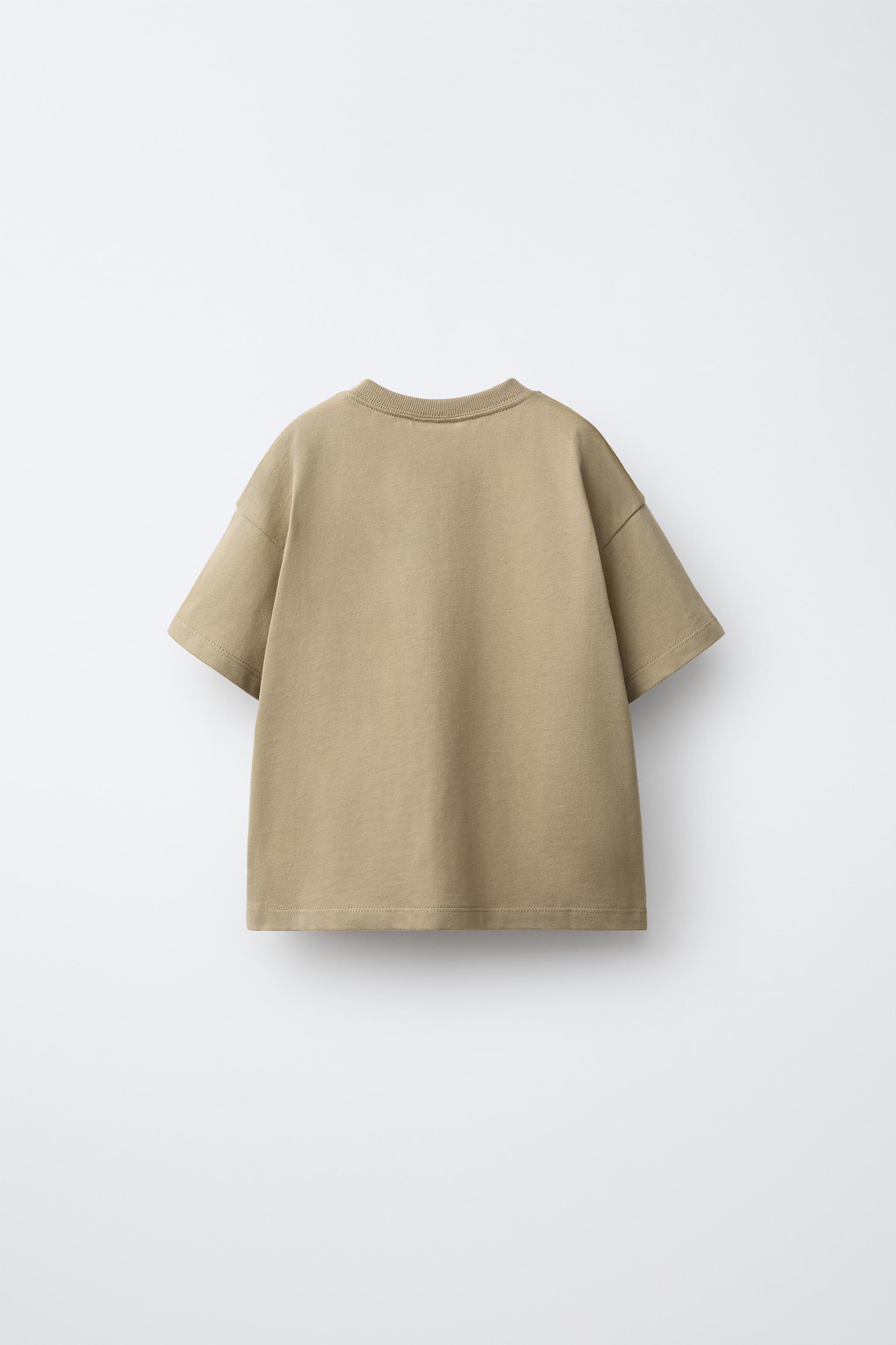 CROSS-STITCH EMBROIDERY © DISNEY PIXAR T-SHIRT — Light brown