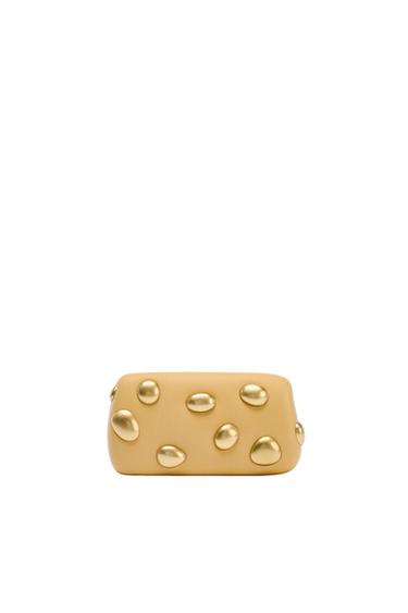 CLUTCH WITH METAL APPLIQUÉS