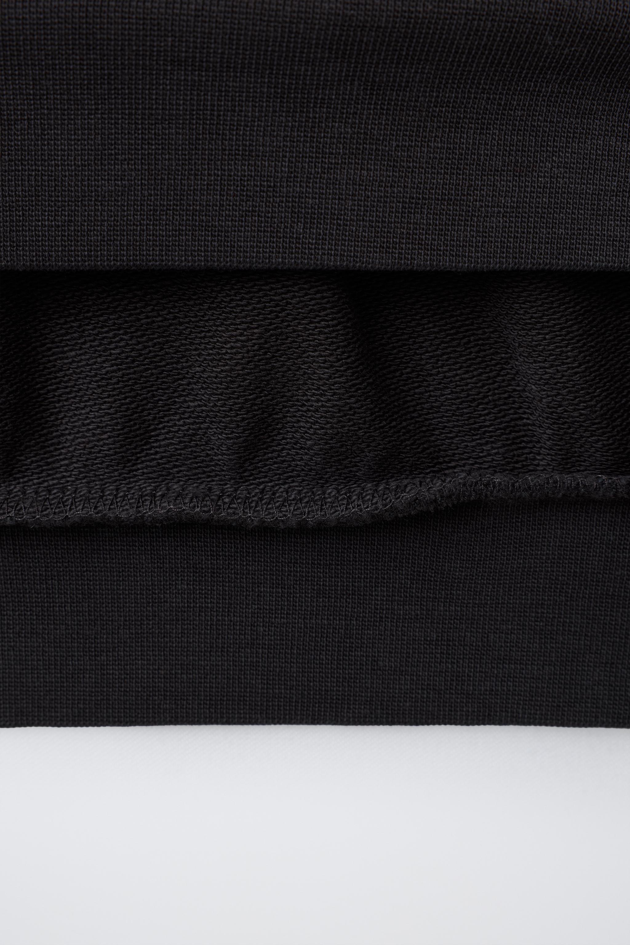 T-SHIRT EN MOLLETON AVEC INSCRIPTION