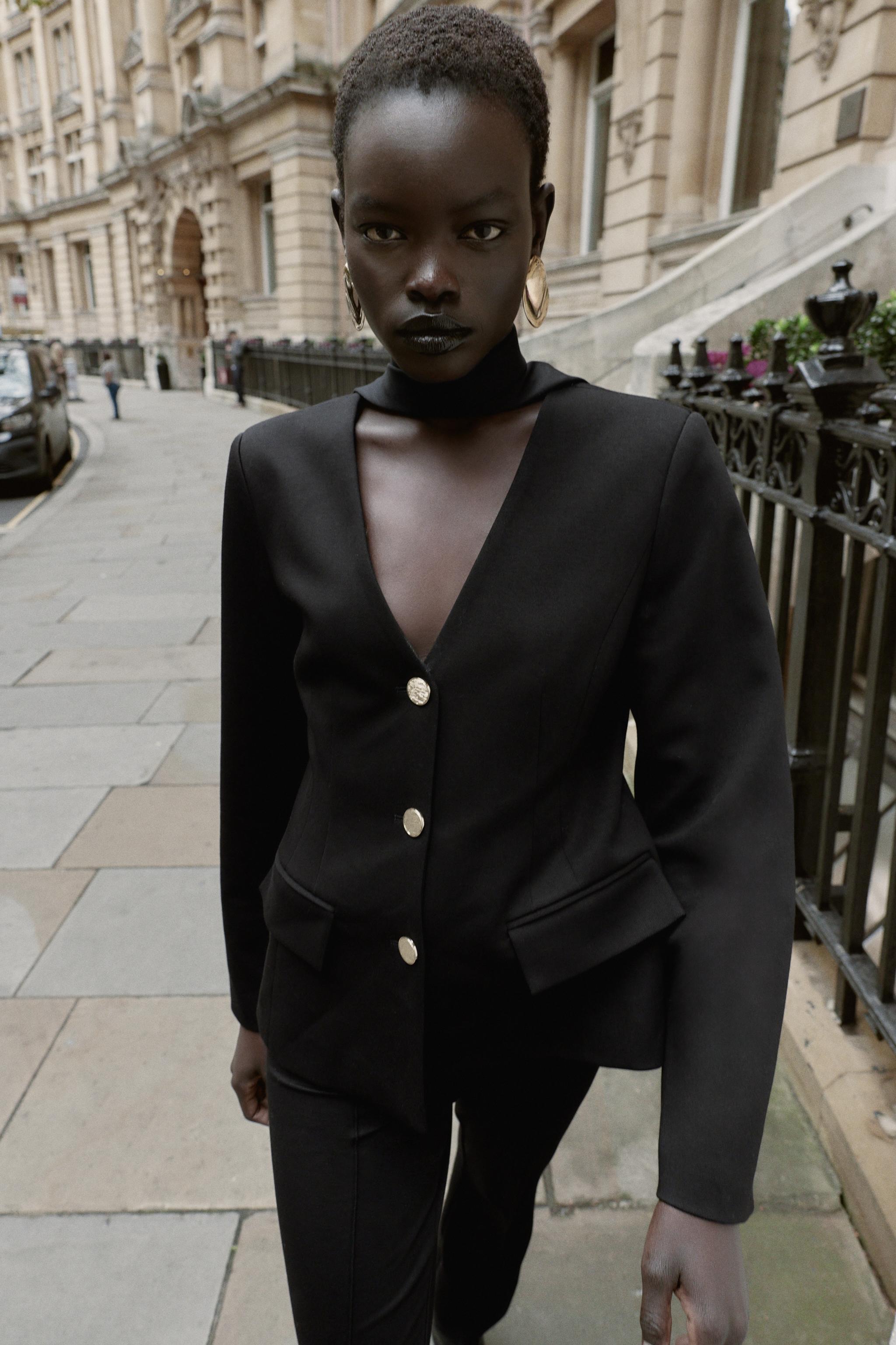 VESTE COURTE À ÉPAULETTES