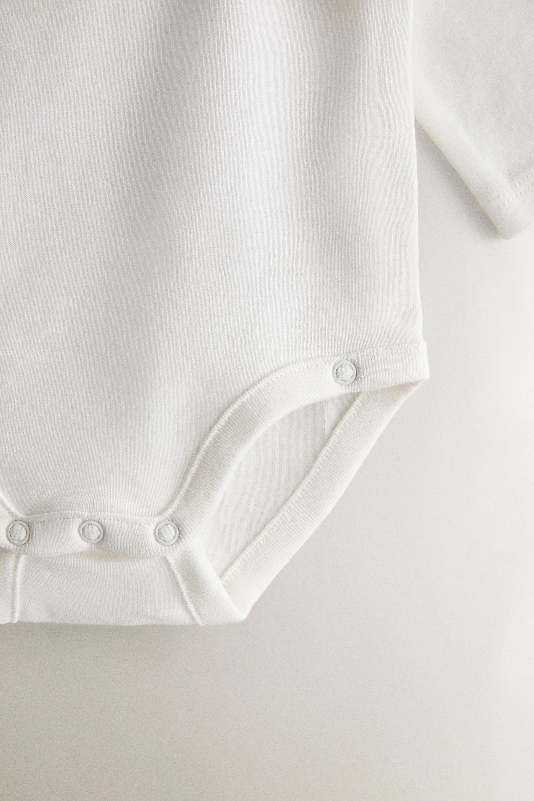EMBROIDERED COTTON BODYSUIT SET (PACK OF 7)