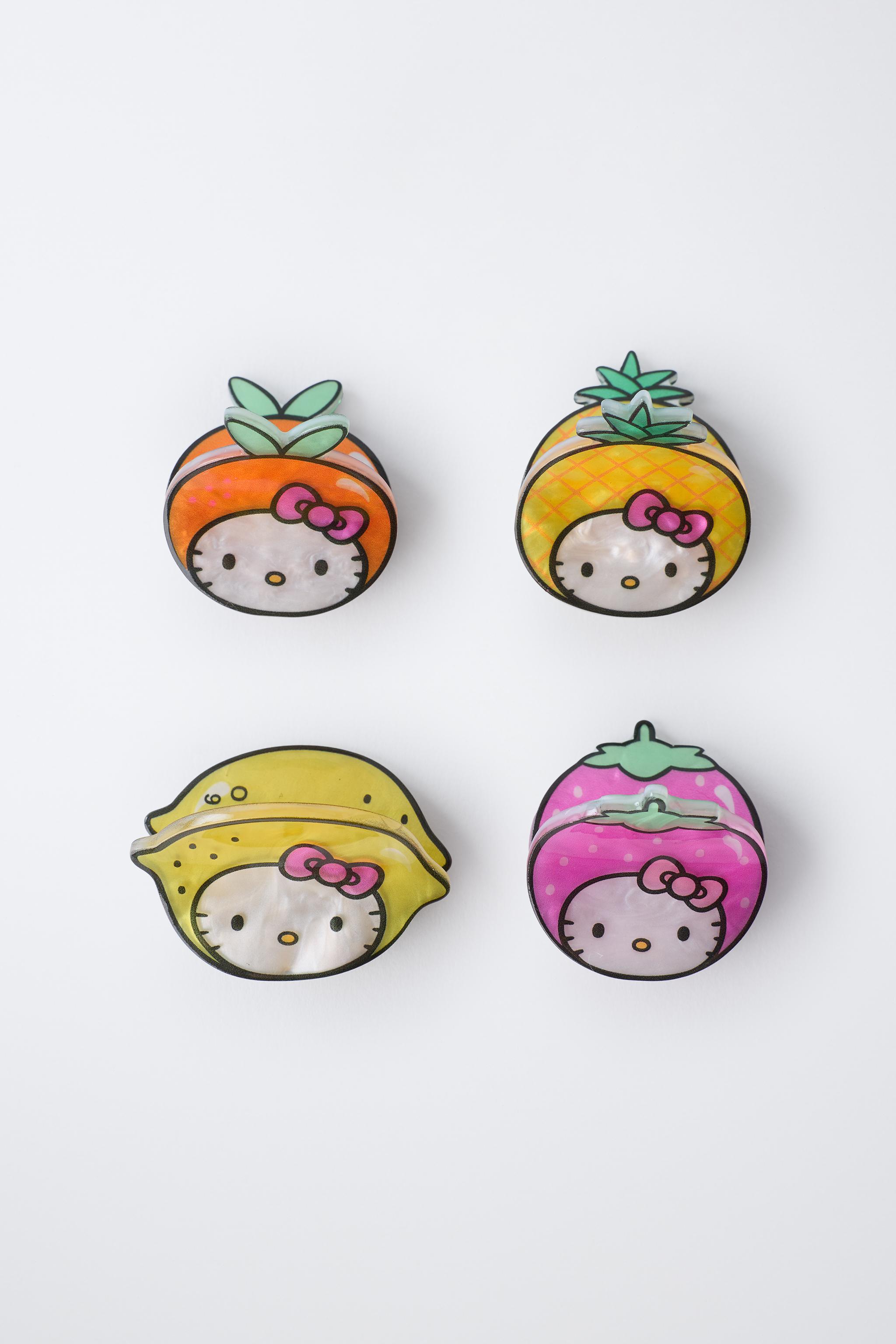 LOT DE QUATRE PINCES FRUITS HELLO KITTY © SANRIO