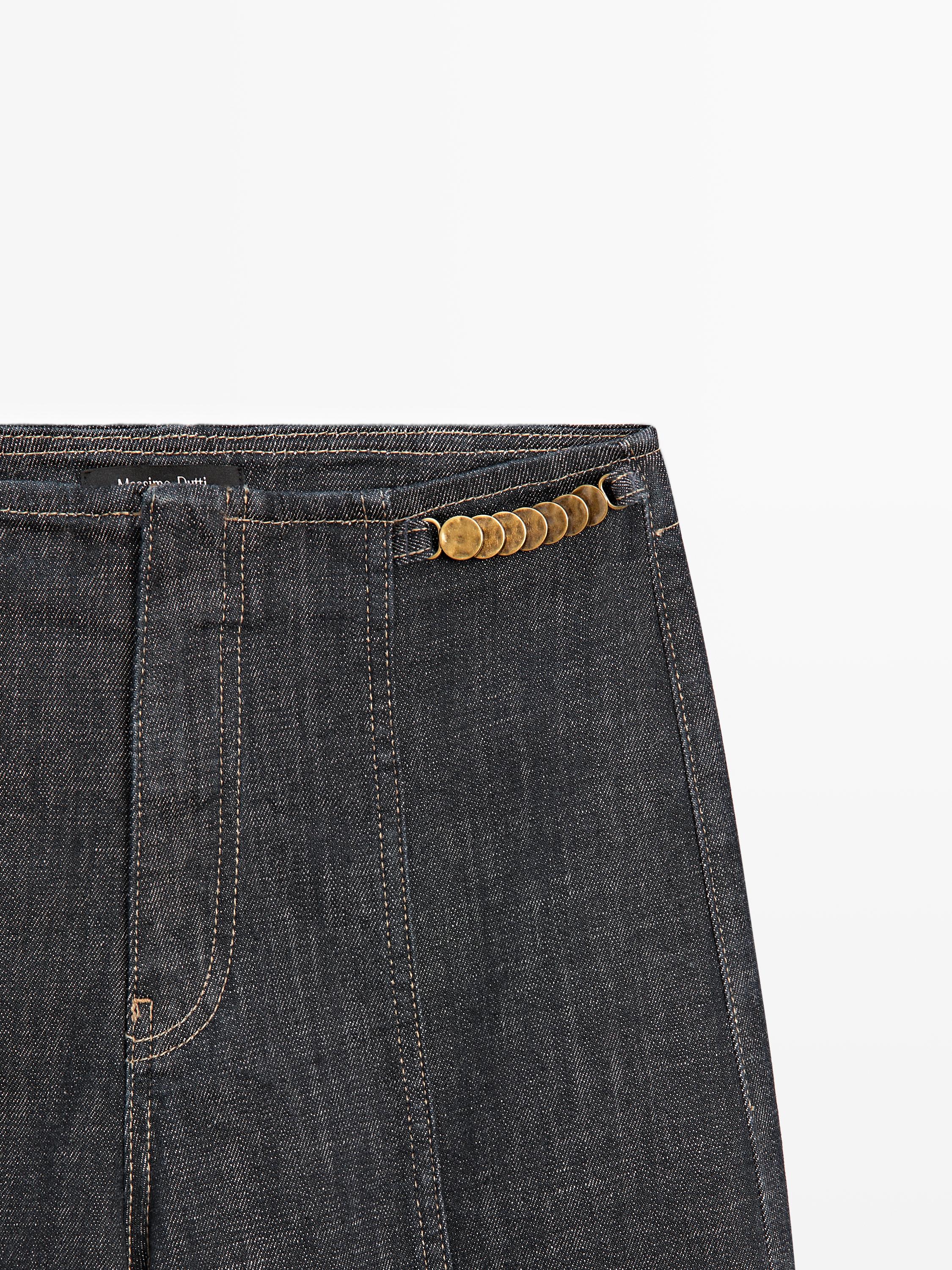 High-waist wide-leg jeans with chains