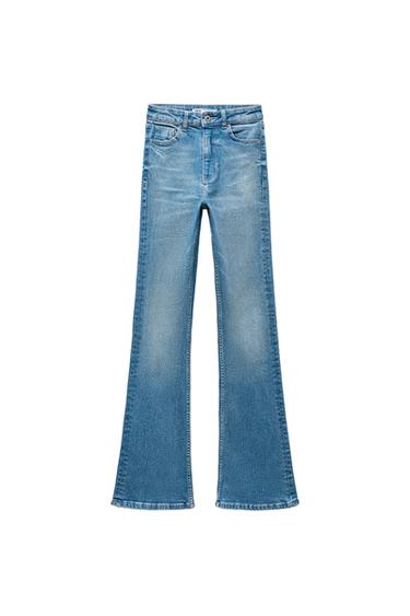 Front view of blue jeans with front pockets and flared leg.