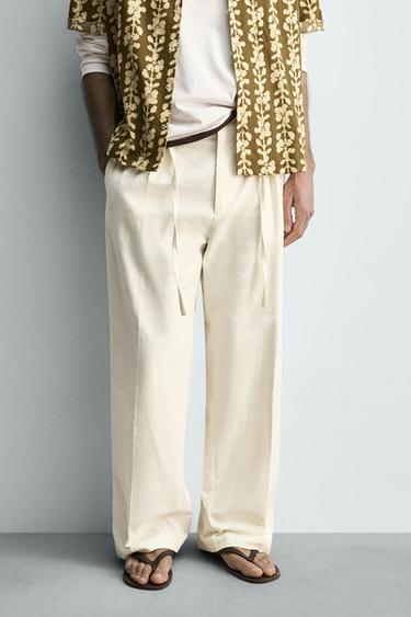 PANTALON À PLIS EN COTON ET LIN - Écru de Zara - Image 1
