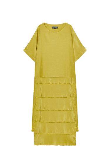 Front view of yellow dress with short sleeves and ruffles at the bottom.