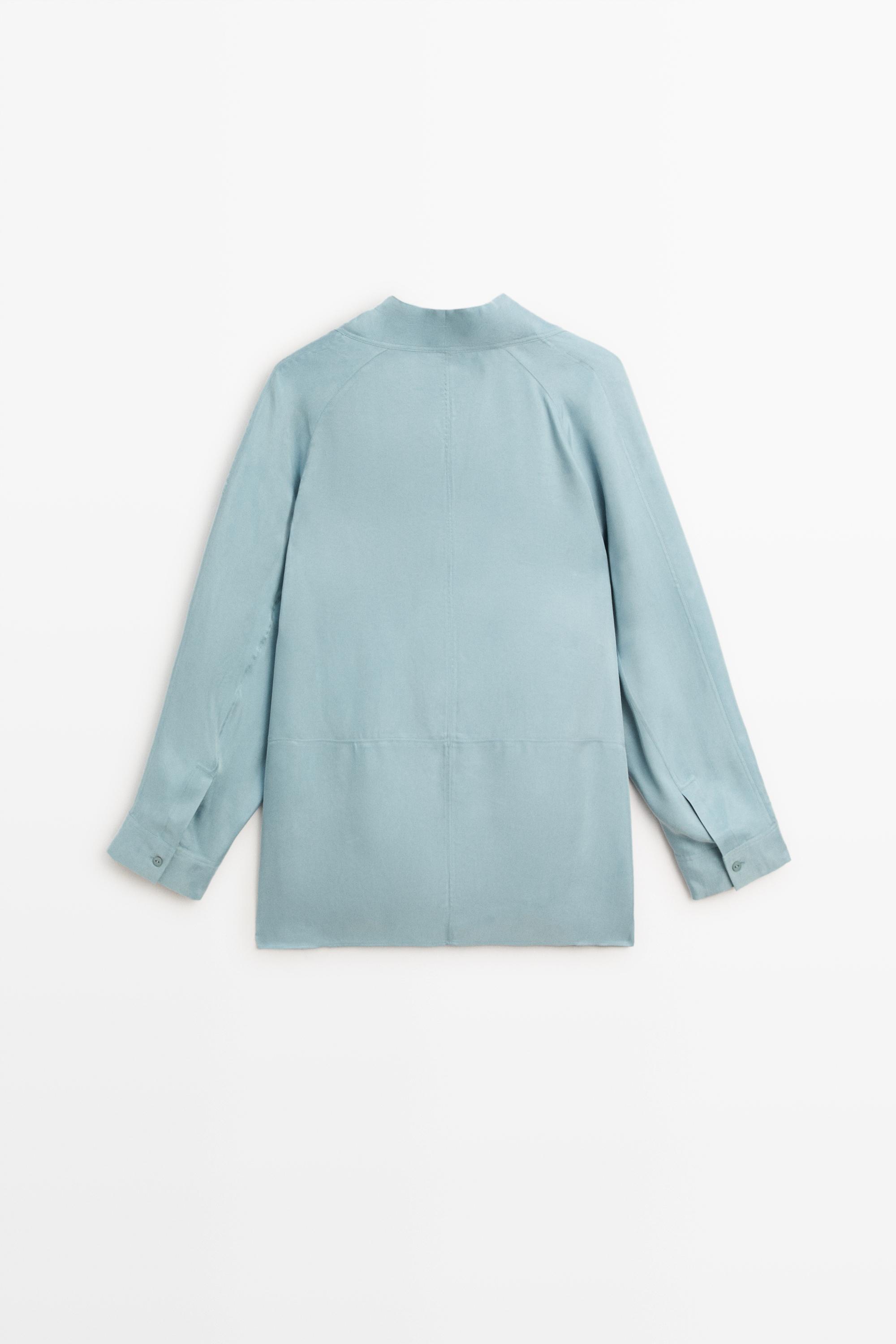 Flowing shirt with high collar and drawstring detail
