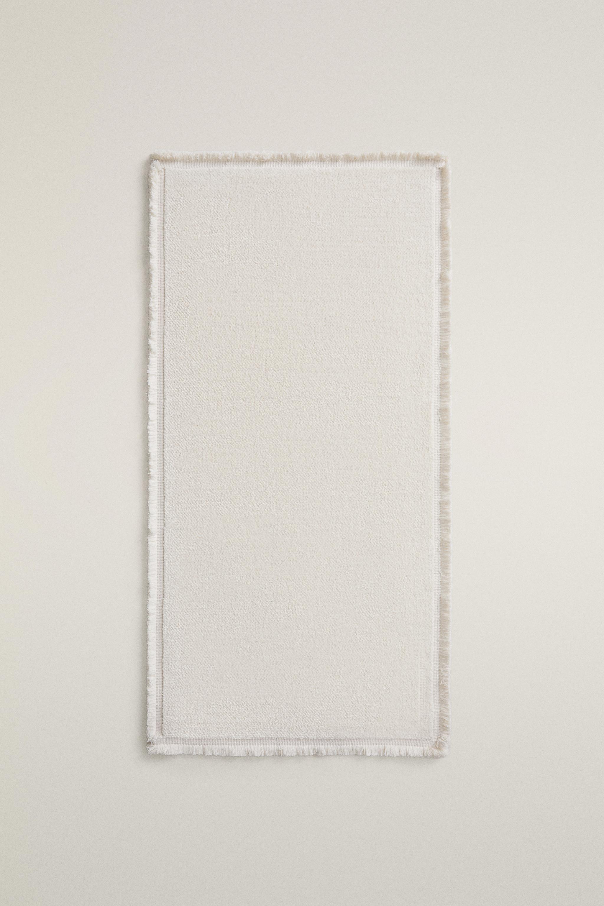 FRINGED AREA RUG