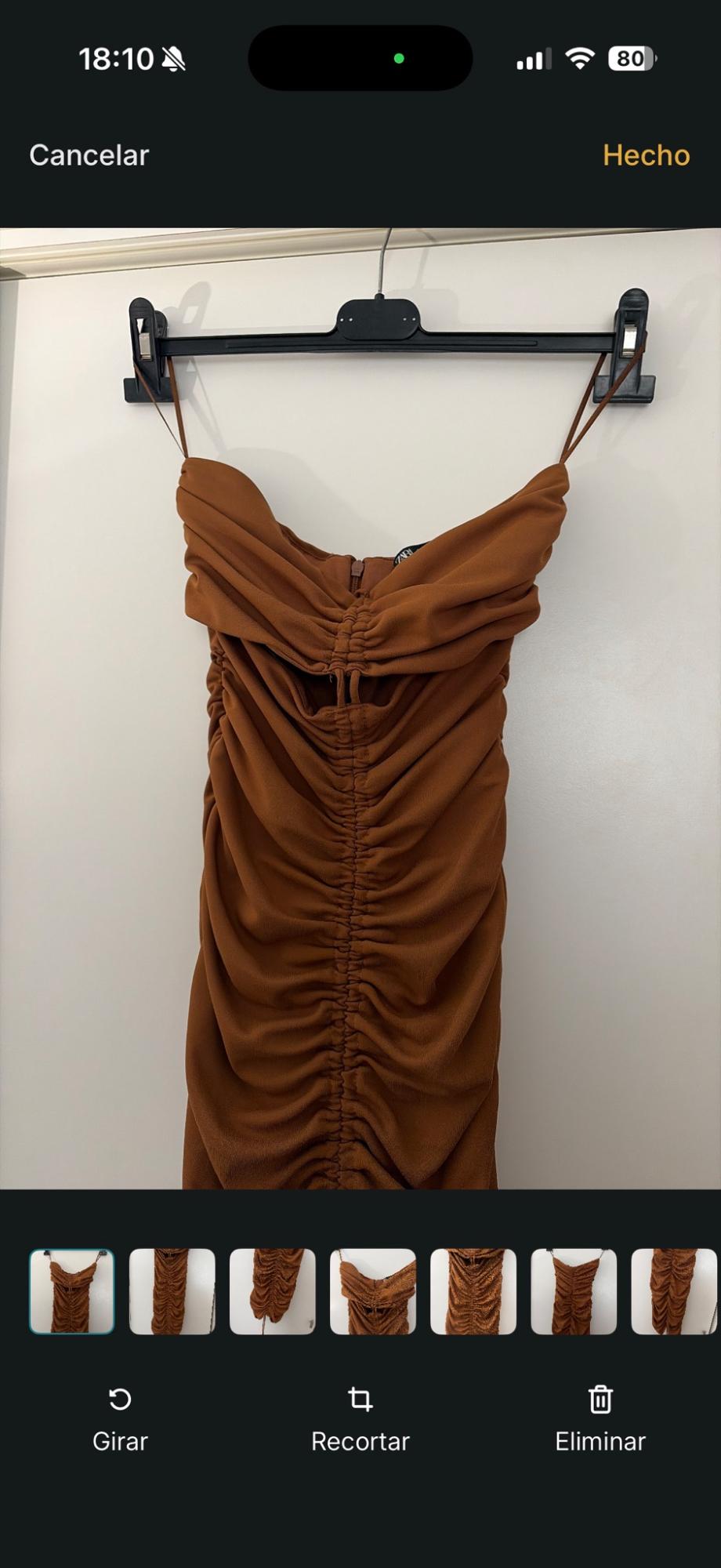 Screenshot of a gathered brown dress on a hanger. Text: 18:10, 80, Cancel, Done, Rotate, Crop, Delete.