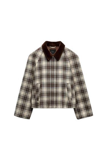 Front view of brown and beige checked jacket with corduroy collar and side pockets.