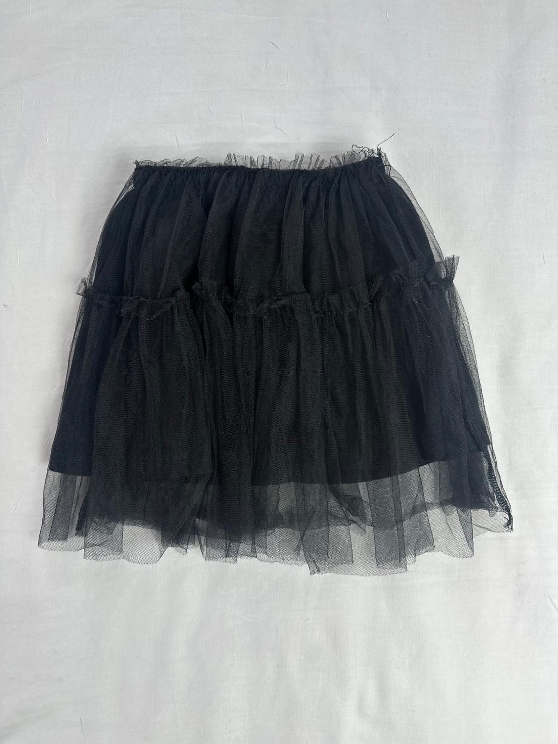 Black tulle short skirt with ruffles and layers, over a plain white background.