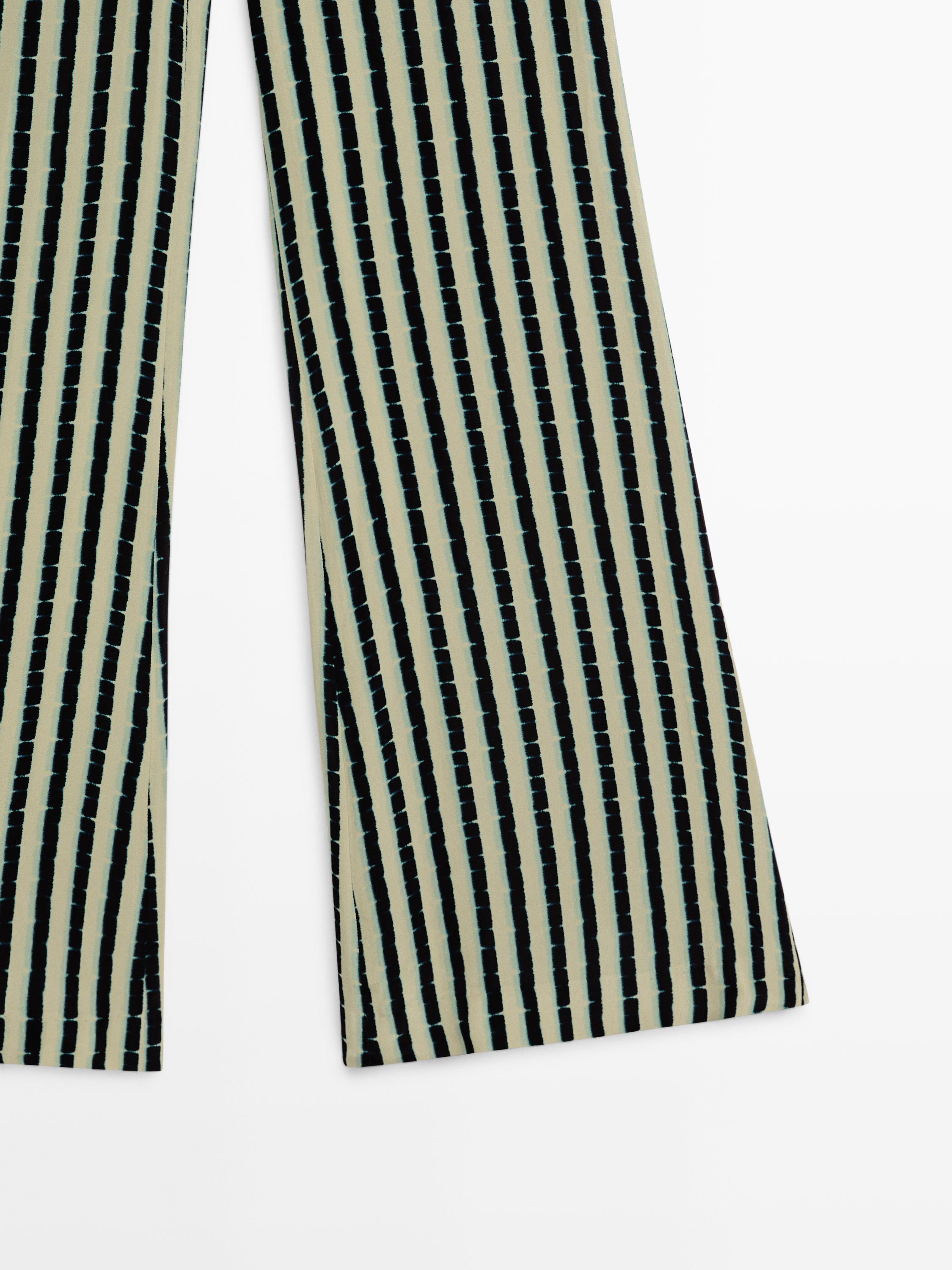 Striped flare fit trousers