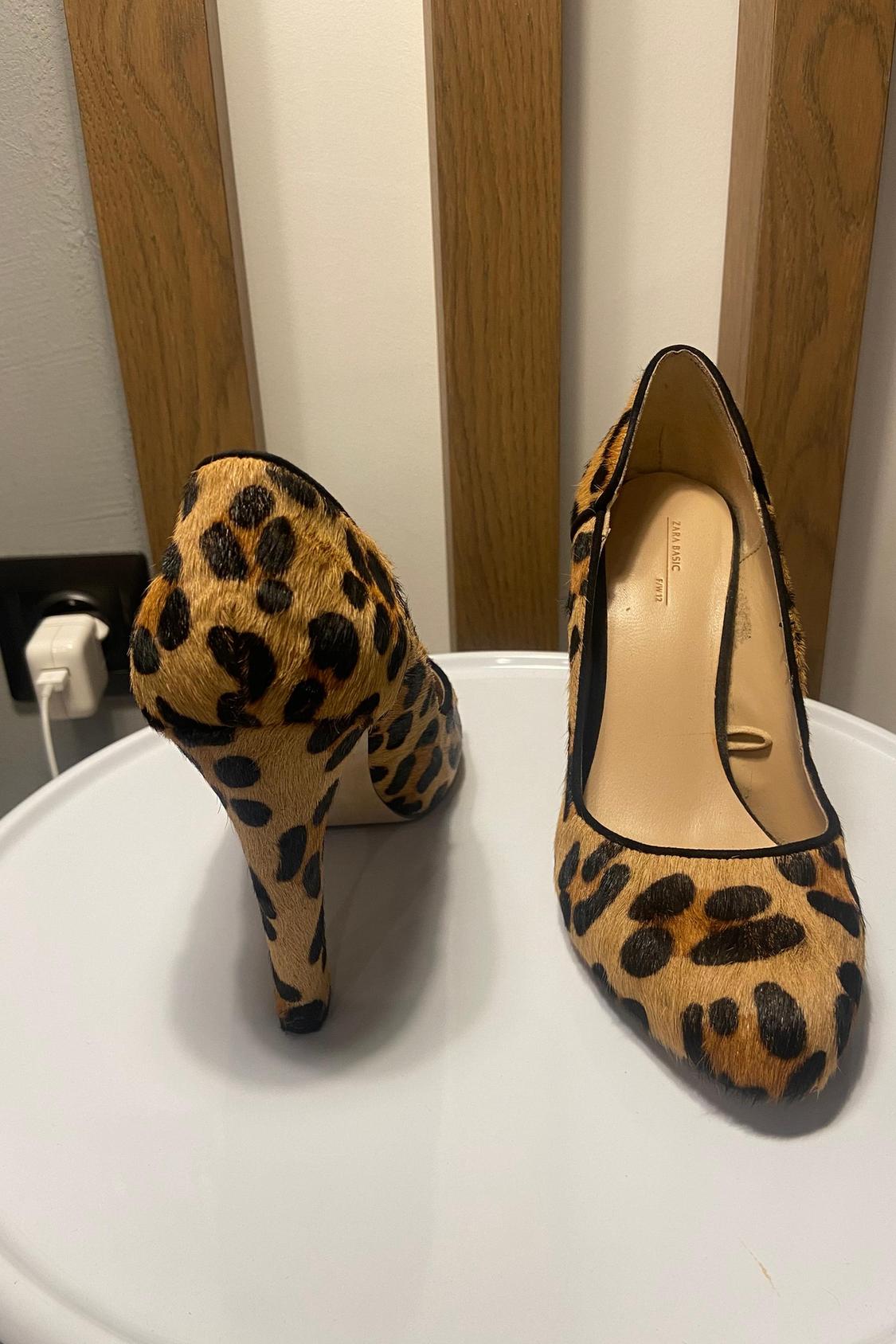 Close-up of leopard print high heels.