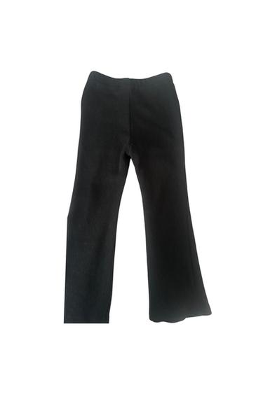 Front view of black wide-leg trousers.