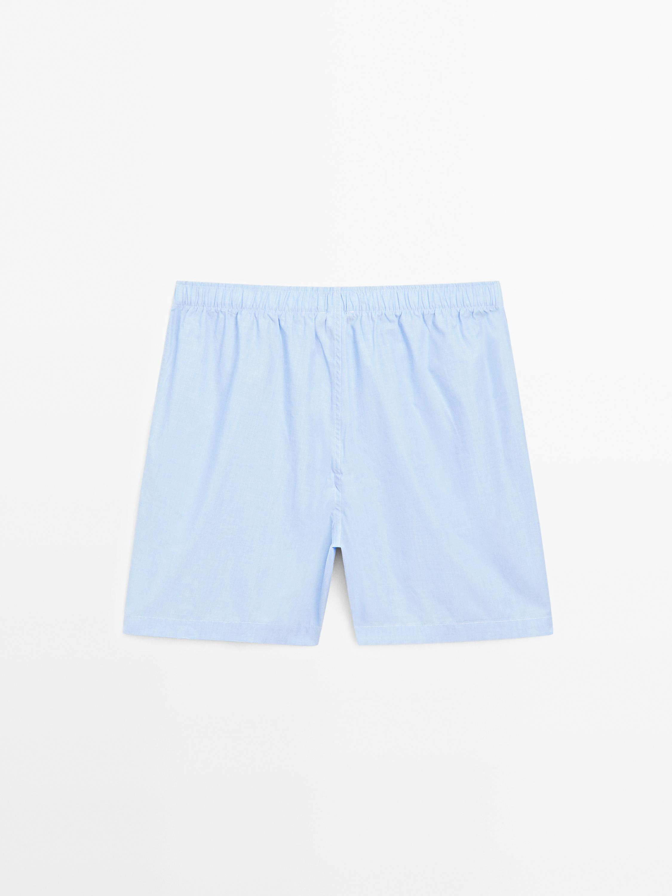 Short sleeve pyjama top and striped trousers