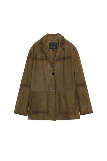 Front view of a light khaki jacket with a lapel collar, button closure, and patch pockets.