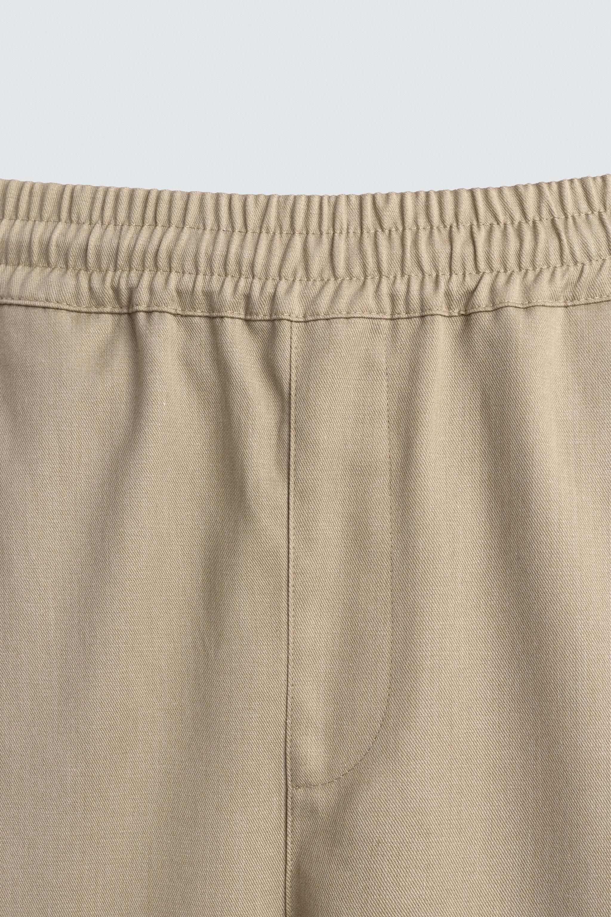PLEATED BALLOON FIT PANTS