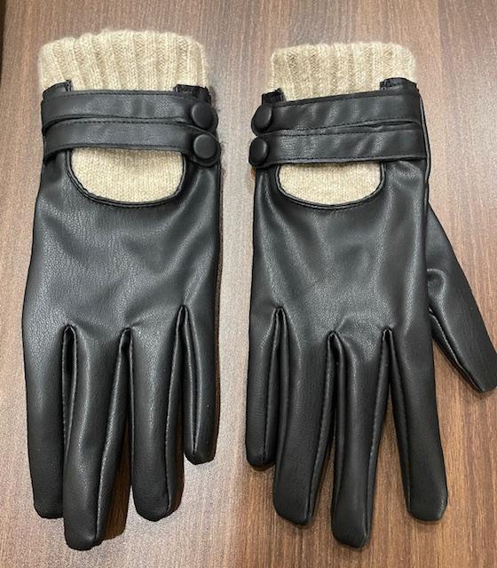 Front view of black gloves with a beige knitted cuff and button fastening.